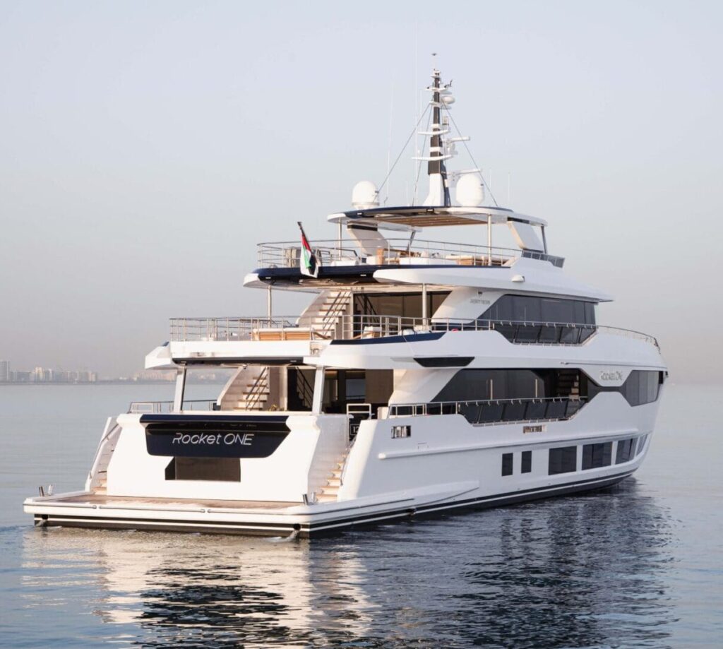 A white and black luxury yacht on the water.