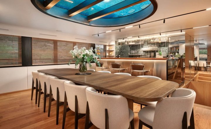 Luxury yacht dining room with glass ceiling.