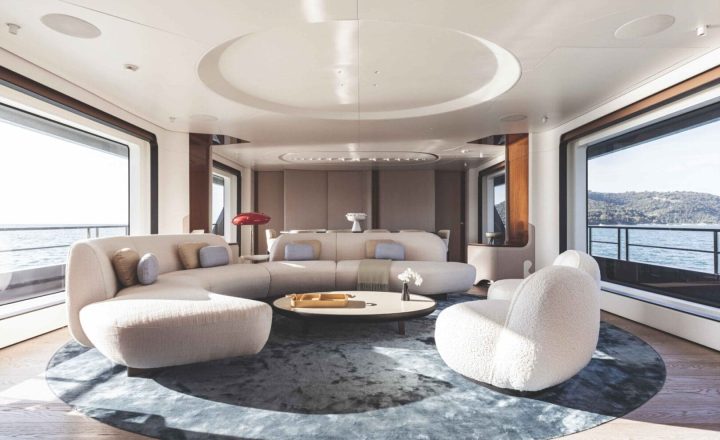 Luxury yacht interior with soft seating and ocean views.