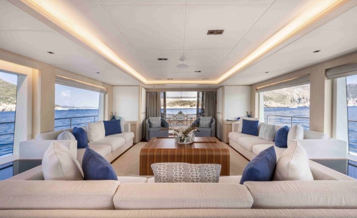 Luxury yacht saloon with comfortable seating.