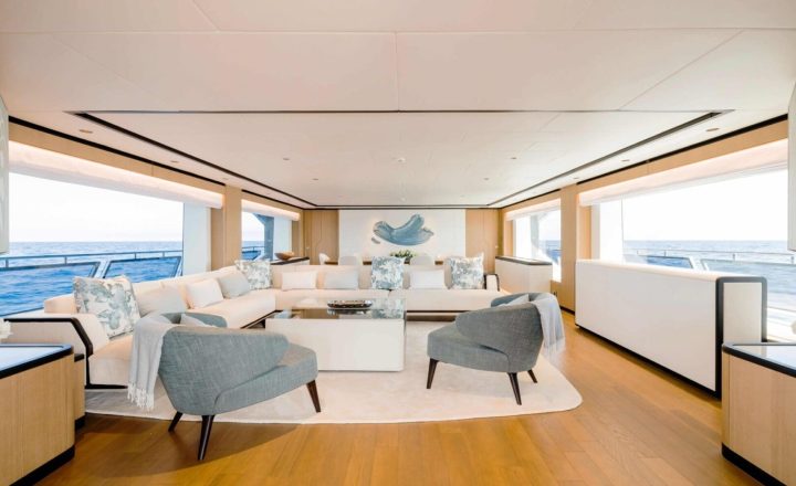 Luxurious yacht saloon with panoramic windows.