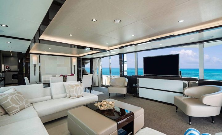 Modern yacht interior with white leather seating.